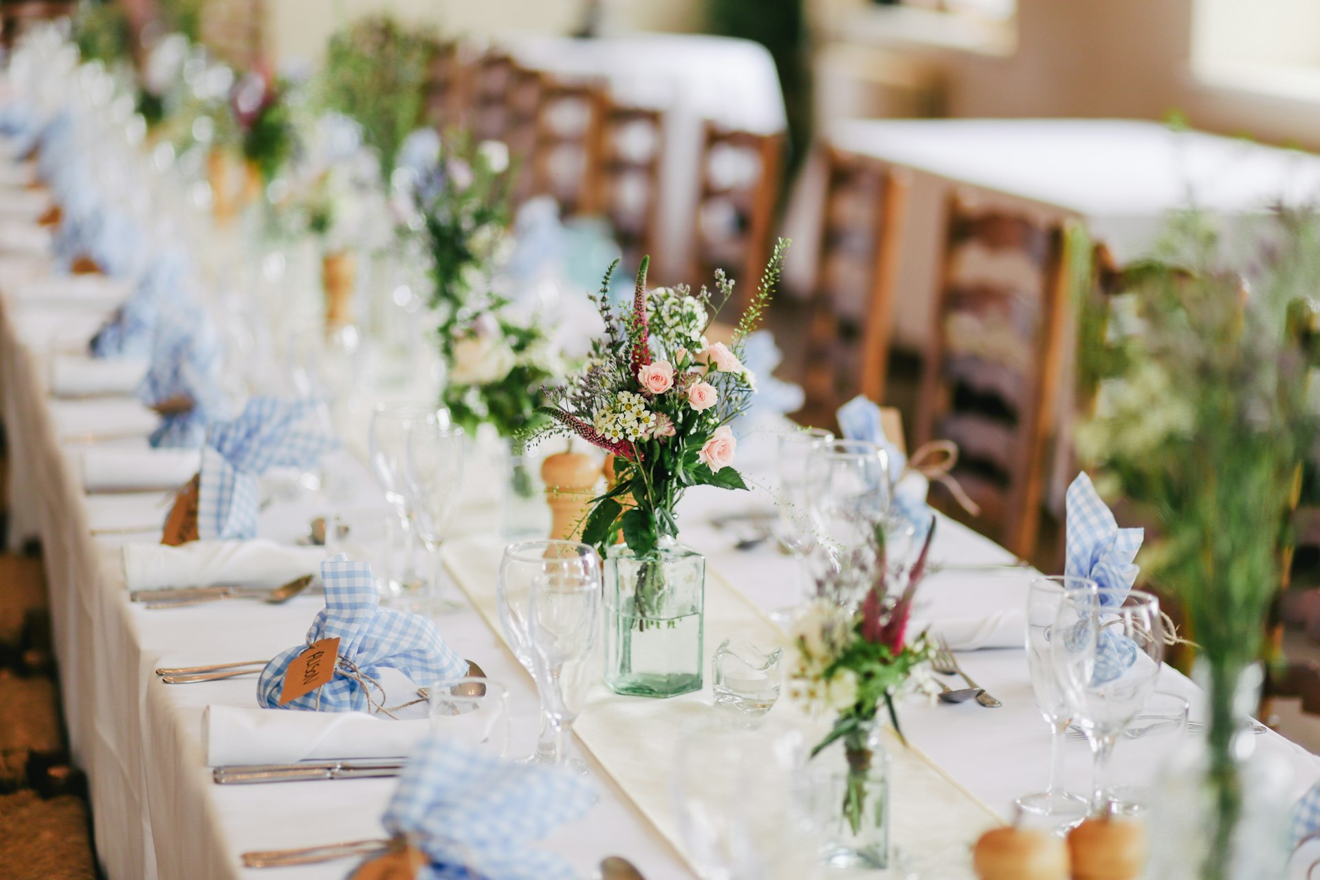 A romantic outdoor wedding with sophisticated floral arrangements and ambient lighting.